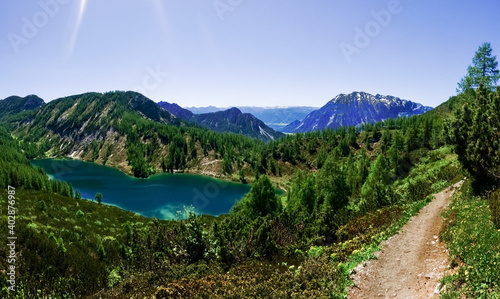 glittering water from a wonderful blue mountain lake panorama