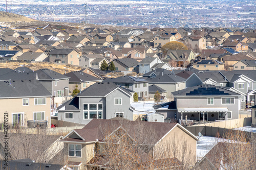 Homes on a Utah Valley community with snow covered terrain suring winter