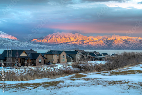 Utah Valley on a winter scene with lake and Wasatch Mountain view at sunset