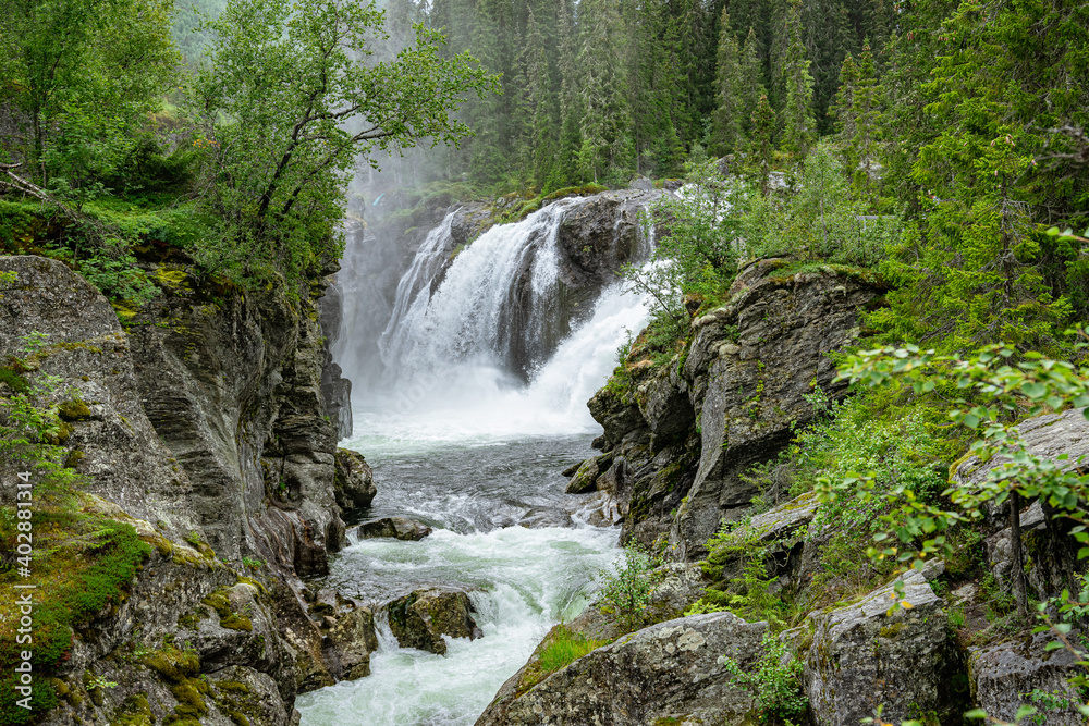Naklejka premium View to the Rjukandefoss waterfall through a canyon