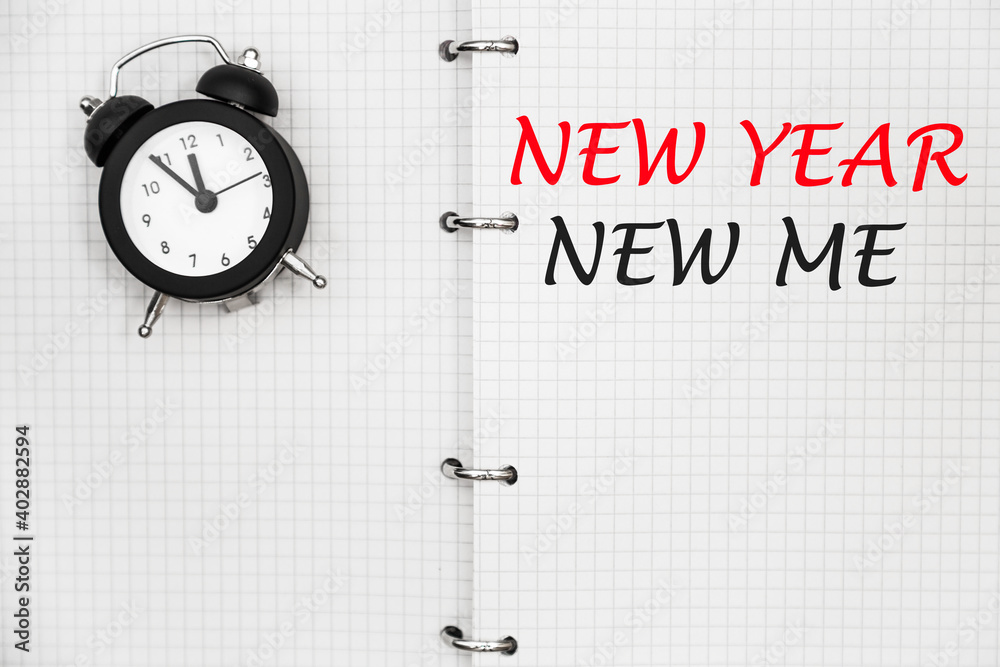 NEW YEAR NEW ME. THE TEXT IS WRITTEN IN A NOTEBOOK. NEW YEAR NEW ME. THE TEXT IS WRITTEN IN A NOTEBOOK.