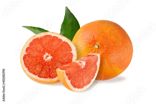 Fresh juicy grapefruit and slices with leaves isolated on white
