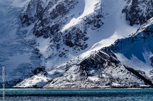 Photography Fresh fallen snow covers Elephant Island in Antarctica.