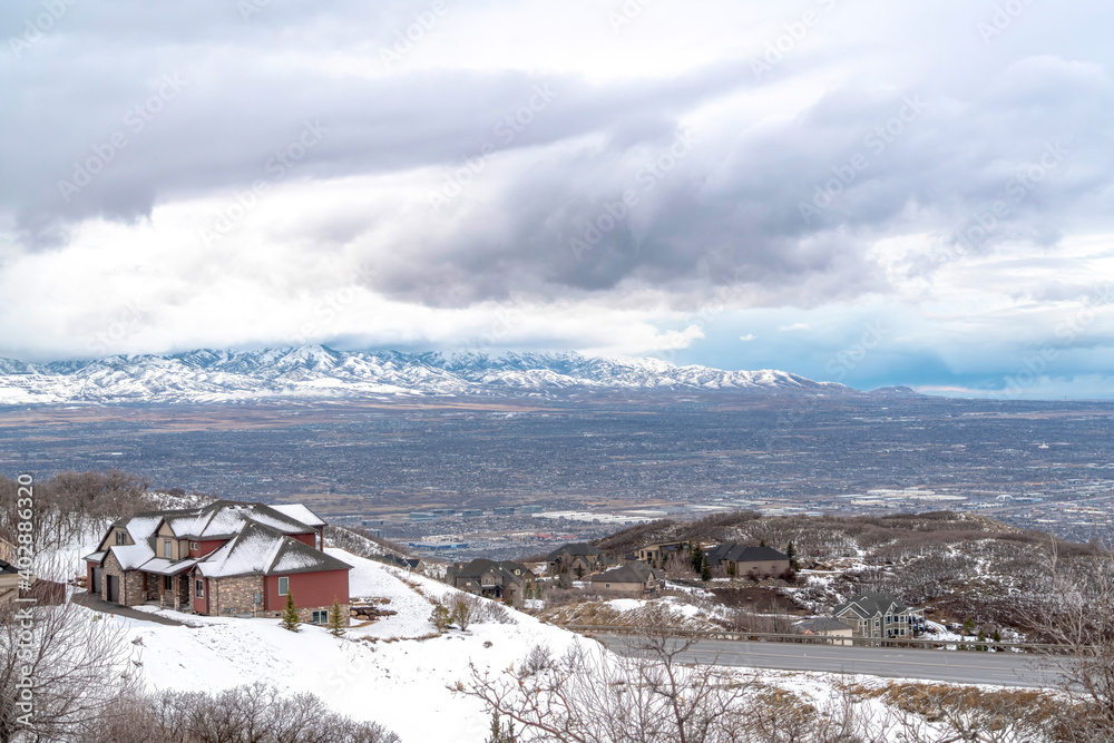 Hill top homes with sweeping view of Utah Valley and Wasatch Mountains in winter