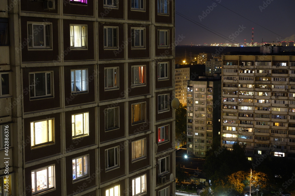 Light in the houses of the sleeping area at night. Moscow, Russia.