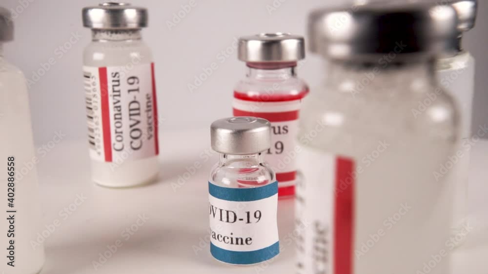 Close-Up Ampoules With Covid-19 Coronavirus Vaccine. Bottle Of Vaccine Close-Up Ampoules With Covid-19 Coronavirus Vaccine. Bottle Of Vaccine