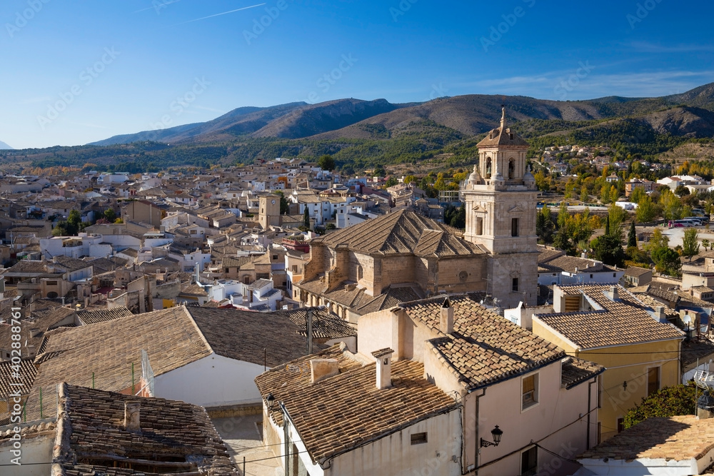 Panorama of the city of Caravaca de la Cruz with many houses with tiled roofs, a place of pilgrimage near Murcia in Spain.