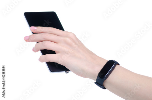 Fitness bracelet device with mobile phone smartphone in hand on white background isolation