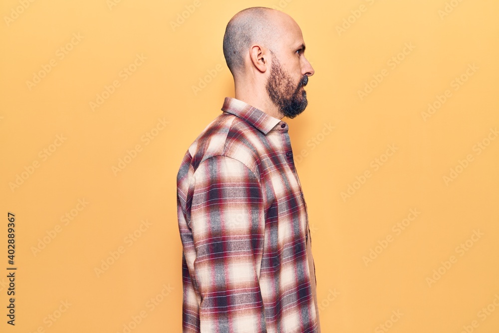 Young handsome man wearing casual clothes looking to side, relax profile pose with natural face with confident smile. Young handsome man wearing casual clothes looking to side, relax profile pose with natural face with confident smile.