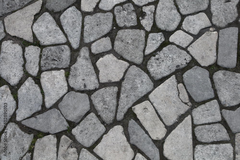 Background of stones. Empty background. The road is paved with stones Background of stones. Empty background. The road is paved with stones
