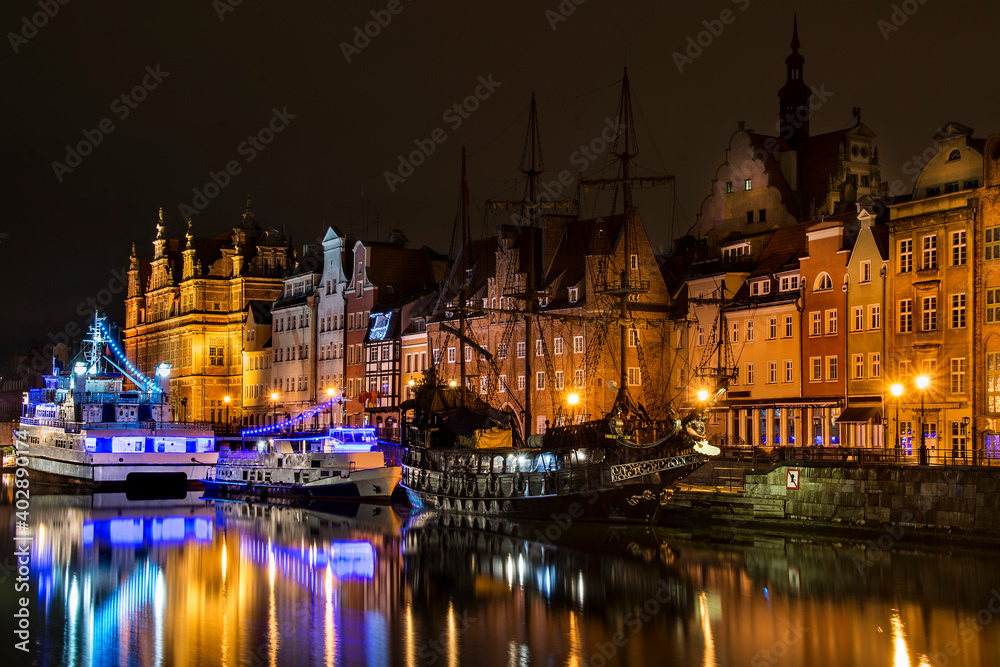 Ships on the Motlawa river, old town of Gdansk by night, Poland