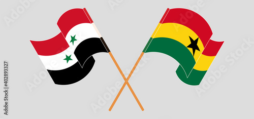Crossed and waving flags of Syria and Ghana
