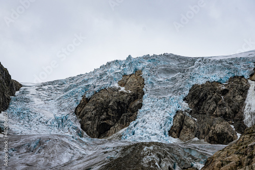 Buerbreen glacier with rocks around it photo