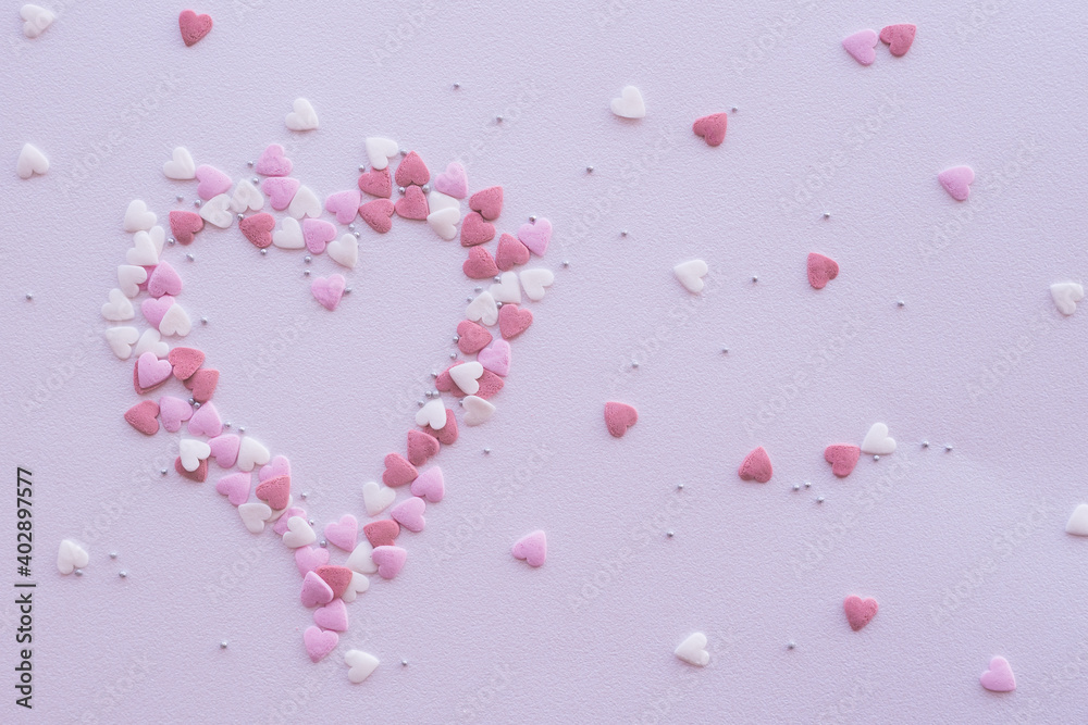 Pink sprinkles background, sugar sprinkle hearts, decoration for cake