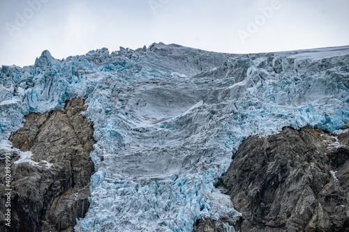 Buerbreen glacier with rocks around it photo