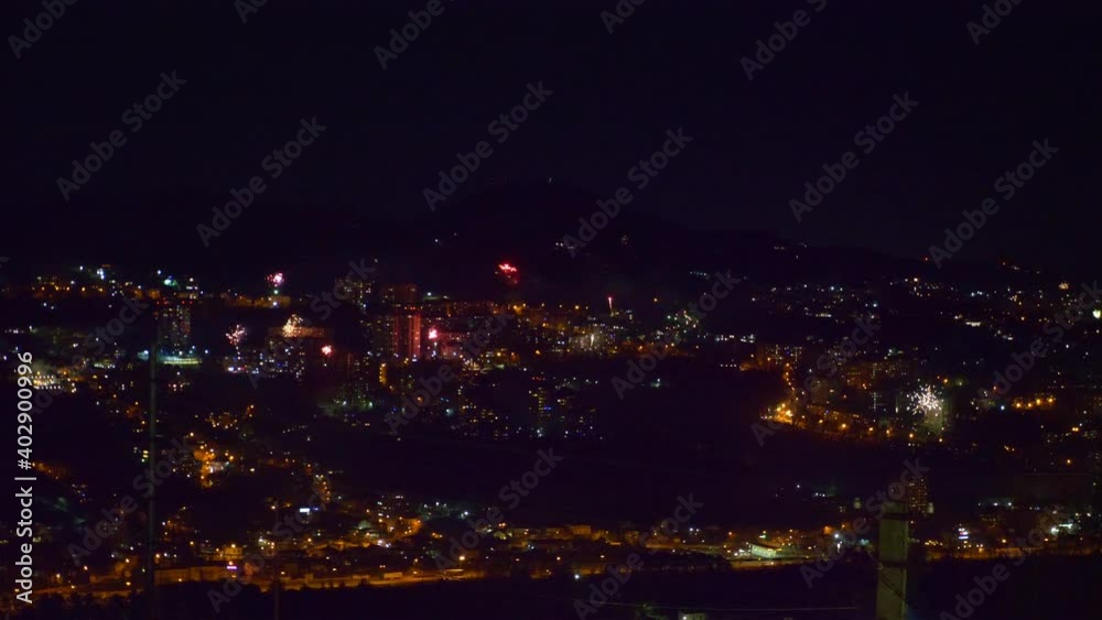 many flashes of fireworks over the night city. general holiday. many flashes of fireworks over the night city. general holiday.