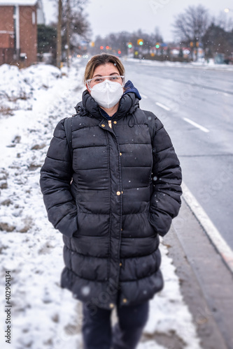 Latin American woman outdoors during a snowy day in the city