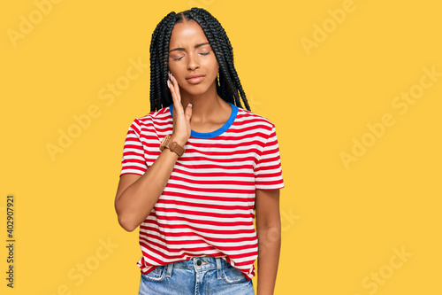 Beautiful hispanic woman wearing casual clothes touching mouth with hand with painful expression because of toothache or dental illness on teeth. dentist