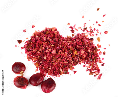Ground Sumac Powder (Rhus) with Sumac Berry Seeds. Isolated on White Background.