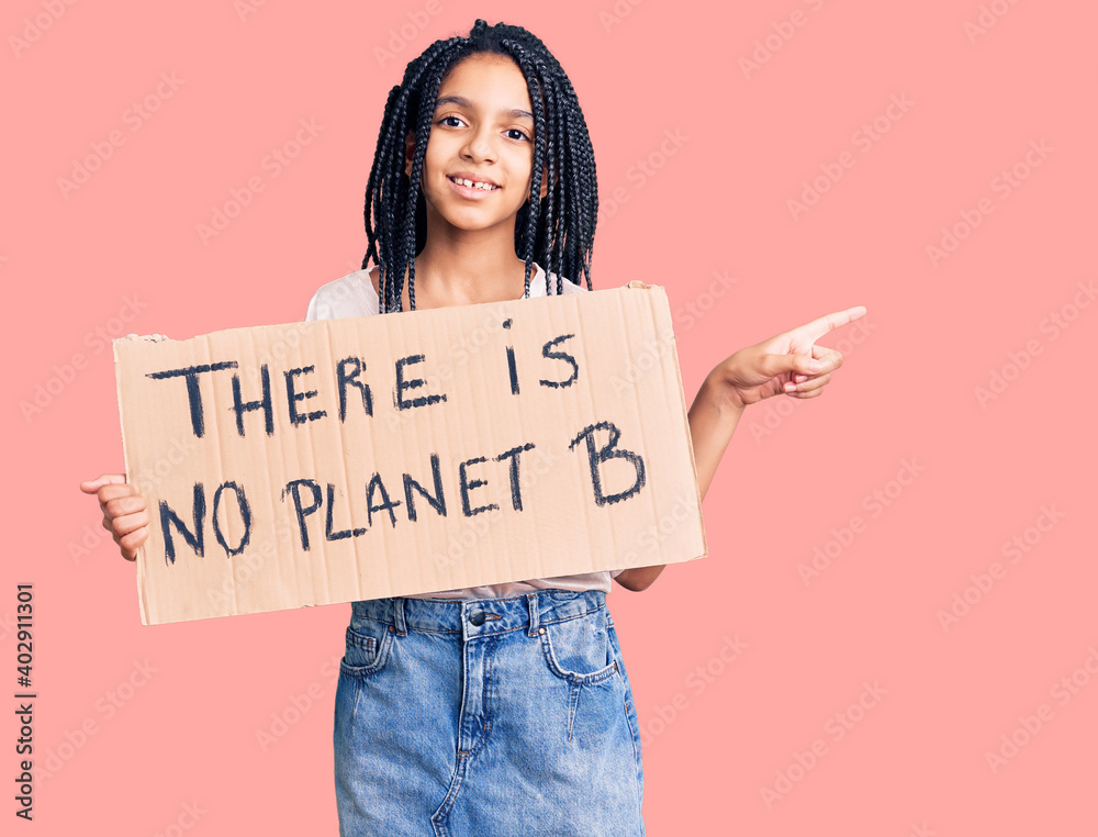 Cute african american girl holding there is no planet b banner smiling happy pointing with hand and finger to the side