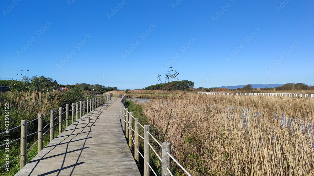 The mouth and estuary of Neiva River in Antas, Esposende, Portugal. The Ecovia Litoral Norte (North Coast Ecoway) wooden boardwalk.