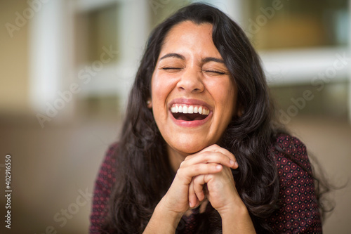 Confident Hispanic woman laughing and smiling stock photo © digitalskillet1