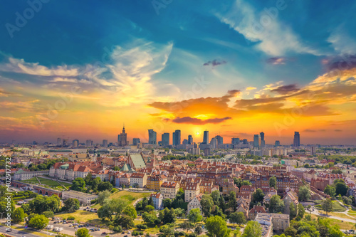Aerial panorama of Warsaw, Poland over the Vistual river and City center in a distance. Sunset sky © netsay