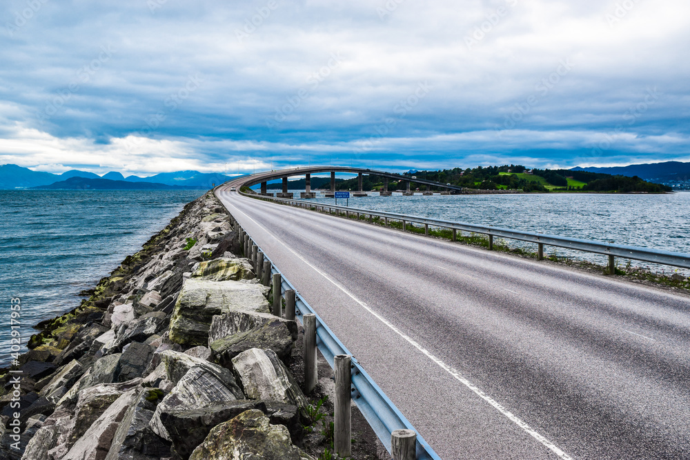 Road 64 to Bolsoy Bridge or Bolsoybrua that crosses the Bolsoysund strait between mainland and island of Bolsoya.  Norway.