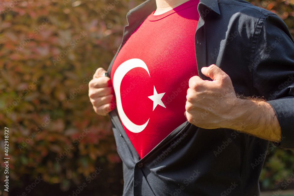 Young turk acting like a superhero and tearing off the shirt on his ...