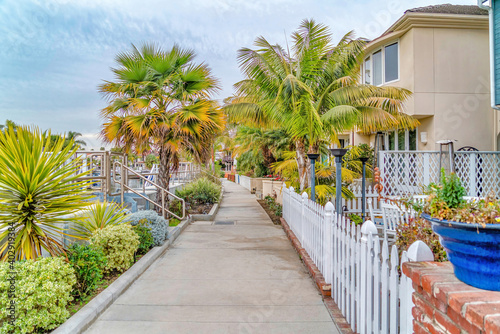 Walkway along canal and houses in the amazing neighborhood of Long Beach CA