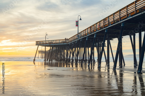 Sunset on the beach and pier. An iconic California wooden pier at 1  370 feet long in the heart of Pismo Beach city in Central California coast.
