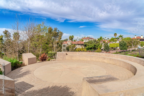 Circular patio with built in bench against homes in Huntington Beach California