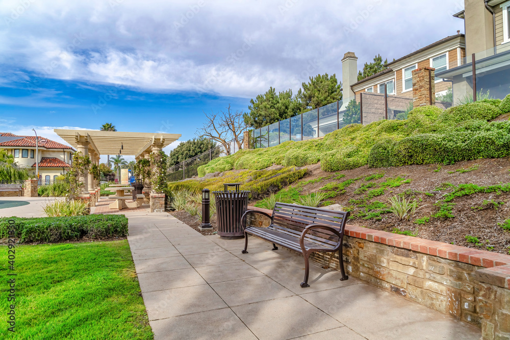 Neighborhood landscape in Huntington Beach California with park and houses Neighborhood landscape in Huntington Beach California with park and houses