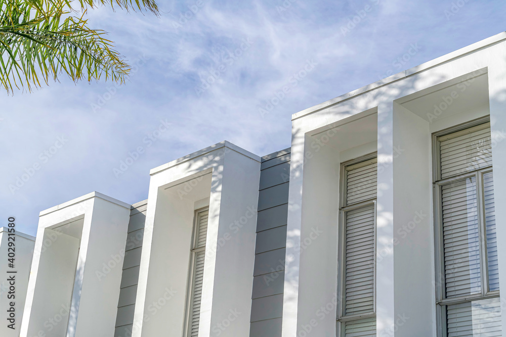 Flat roof and projecting window frames at exterior of home in Huntington Beach Flat roof and projecting window frames at exterior of home in Huntington Beach