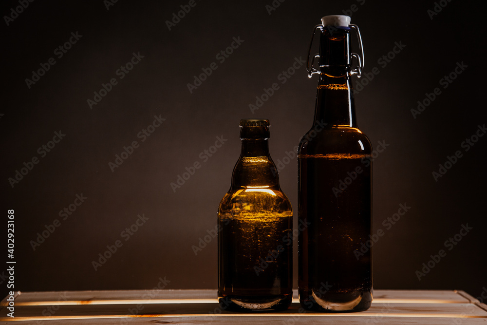 beer bottle on a wooden table and a glass of beer beer bottle on a wooden table and a glass of beer