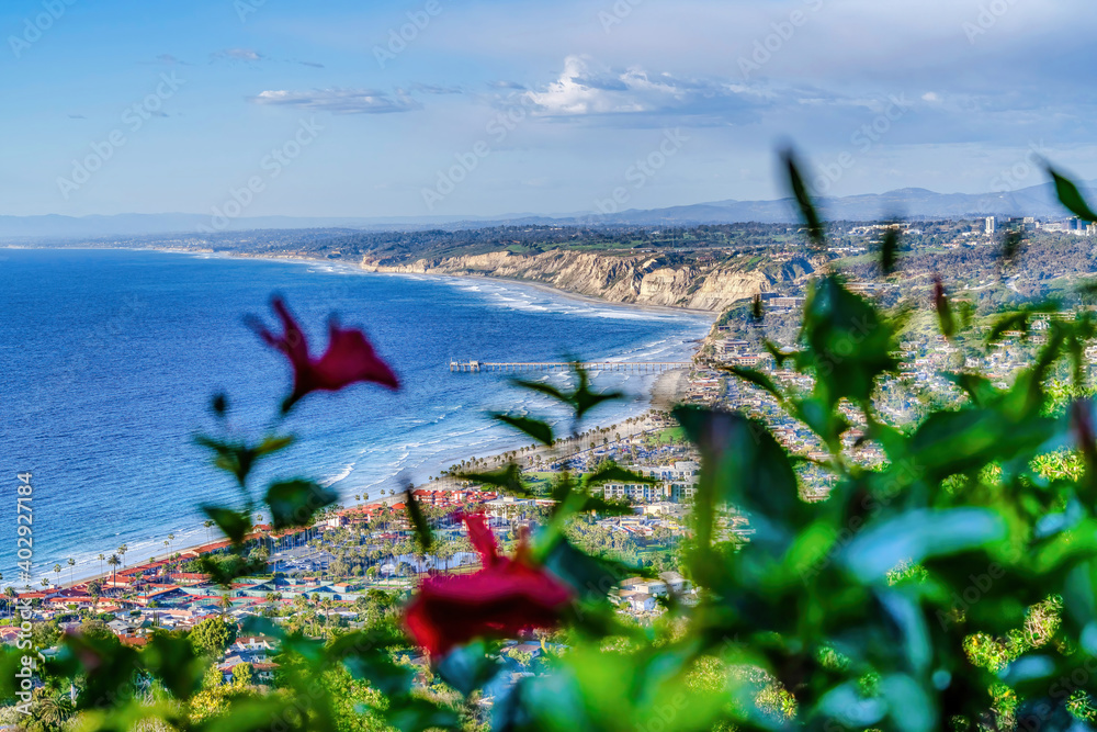 Panoramic aerial view of ocean and land with cloudy sky at San Diego California