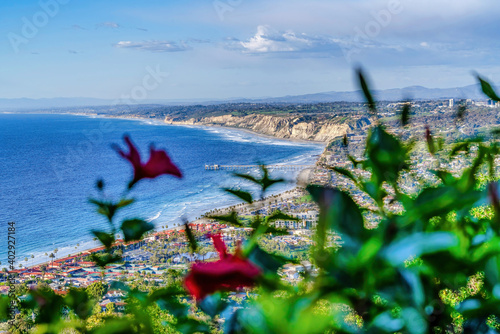 Panoramic aerial view of ocean and land with cloudy sky at San Diego California