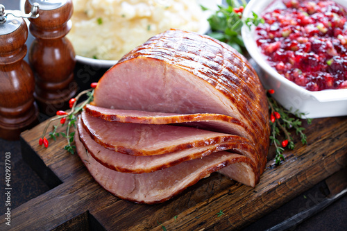 Holiday glazed ham for Christmas dinner with cranberry sauce