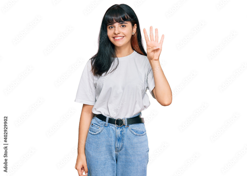 Young hispanic girl wearing casual clothes showing and pointing up with fingers number four while smiling confident and happy. Young hispanic girl wearing casual clothes showing and pointing up with fingers number four while smiling confident and happy.