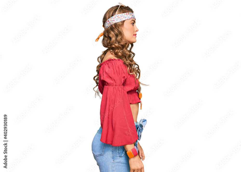 Young blonde girl wearing bohemian and hippie style looking to side, relax profile pose with natural face with confident smile.