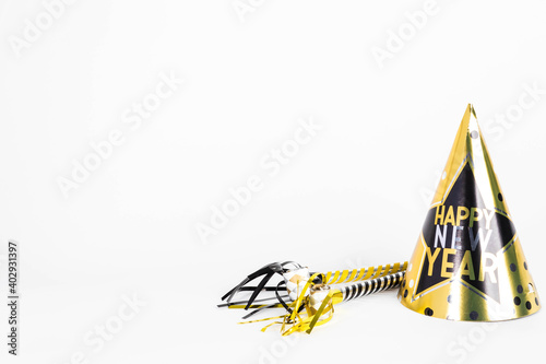 Happy New Years hat with noise makers on white background
