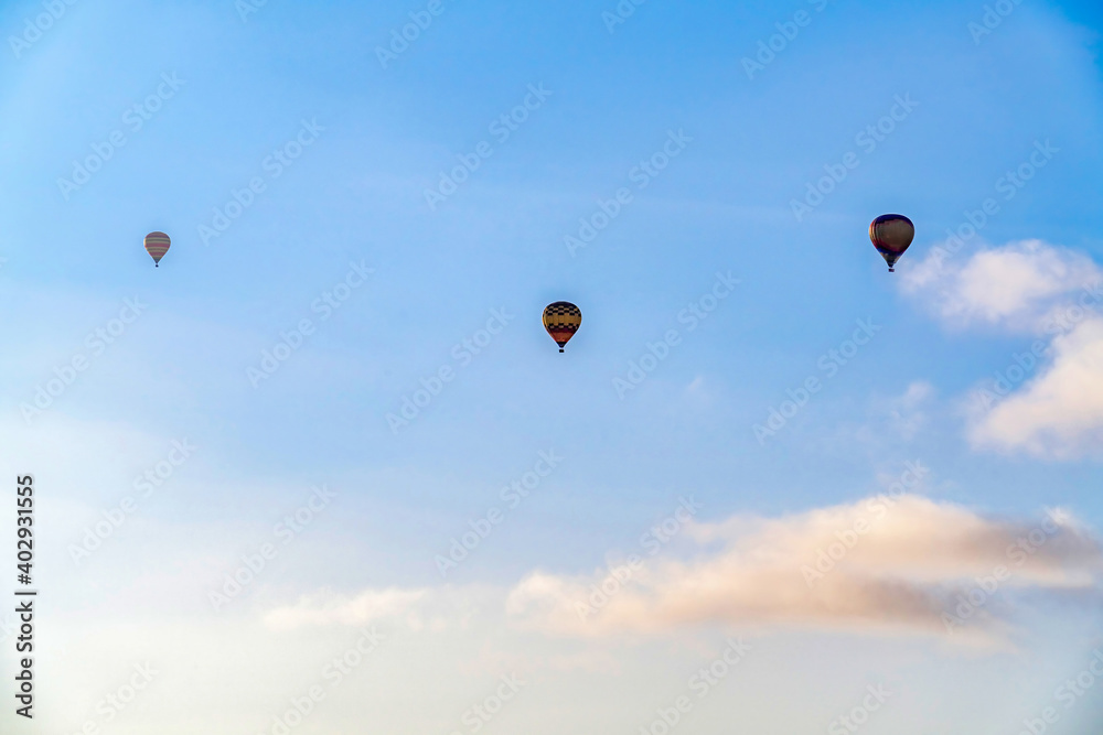 Hot air balloons and cloudy blue sky in San Diego California with bright sun Hot air balloons and cloudy blue sky in San Diego California with bright sun