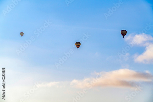 Hot air balloons and cloudy blue sky in San Diego California with bright sun