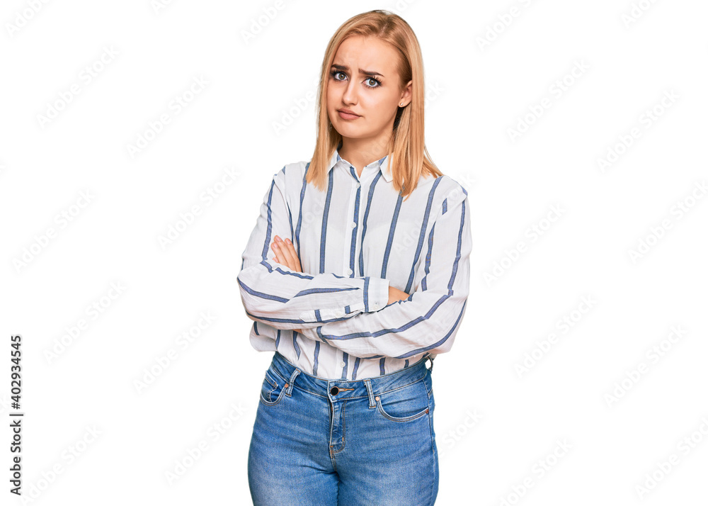 Beautiful caucasian woman wearing casual clothes looking to the side with arms crossed convinced and confident Beautiful caucasian woman wearing casual clothes looking to the side with arms crossed convinced and confident