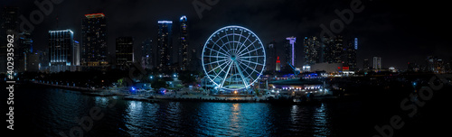 Night aerial panorama Miami Skyviews ferris wheel at Bayside Marketplace reflection in water © Felix Mizioznikov