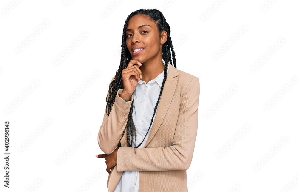 African american woman wearing business jacket looking confident at the camera smiling with crossed arms and hand raised on chin. thinking positive. African american woman wearing business jacket looking confident at the camera smiling with crossed arms and hand raised on chin. thinking positive.