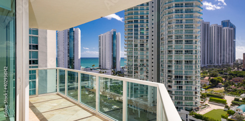 Apartment condominium flat balcony with view of coastal buildings nice scene photo