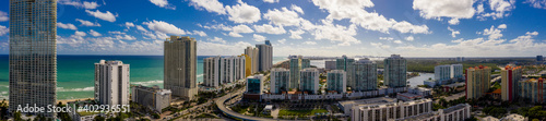 Aerial panorama Sunny Isles Beach facing south at 163rd Street highrise beachfront condominiums in photo © Felix Mizioznikov