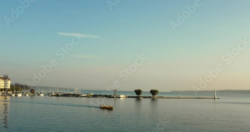 Aerial drone view of Boat ferry across lake geneva in the morning sunrise