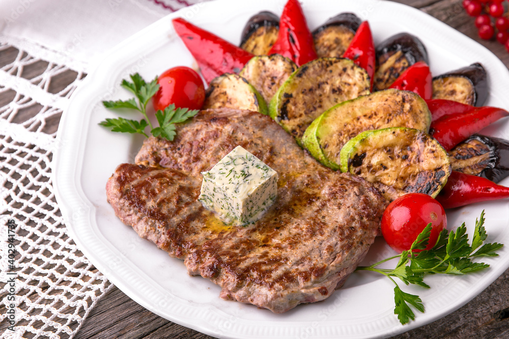 Pork steak grilled with grilled vegetables. Balkan cuisine. National cuisine. Nourishing, useful, natural. Rustic cuisine. Pork steak grilled with grilled vegetables. Balkan cuisine. National cuisine. Nourishing, useful, natural. Rustic cuisine.